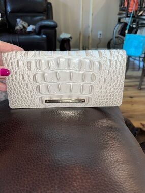 Sold Bb Like new authentic Brahmin Ady croc embossed leather bifold wallet.
